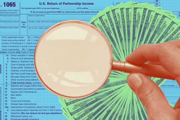 Stylized image representing audits of high earners and partnerships. In the background is Tax Form 1065 for partnership returns. In the foreground is a hand holding a large magnifying glass, with stacks of $100 bills fanned out around it.